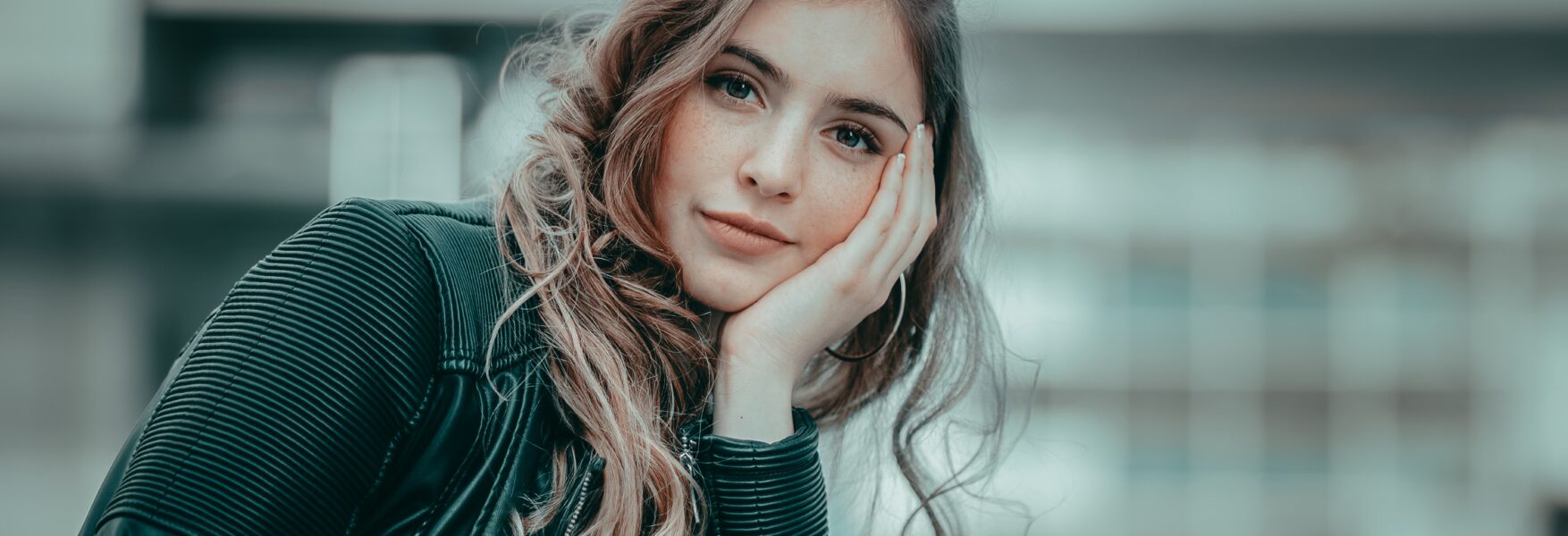 woman resting her head on her hand